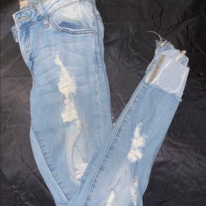 Distressed blue jeans